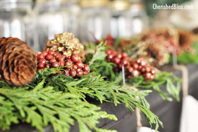 A Rustic Christmas Mantel featuring real cedar garland and drop cloth stockings
