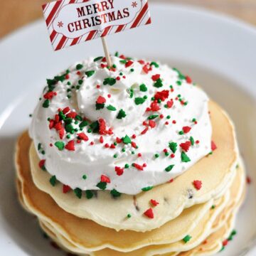 Enjoy these Merry Christmas Chocolate Chip Pancakes with Homemade Whipped Topping. Perfect for that Christmas morning!