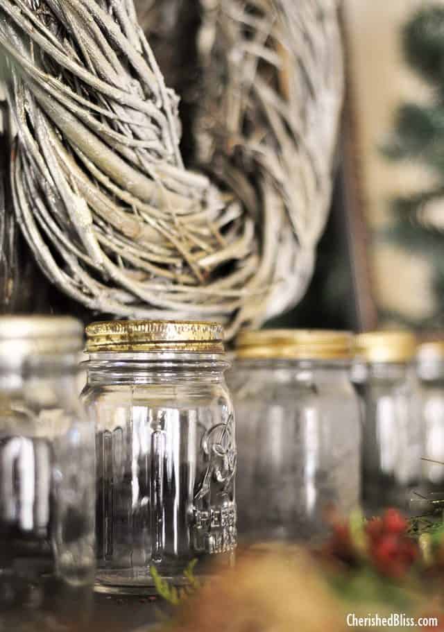 A Rustic Christmas Mantel featuring real cedar garland and drop cloth stockings