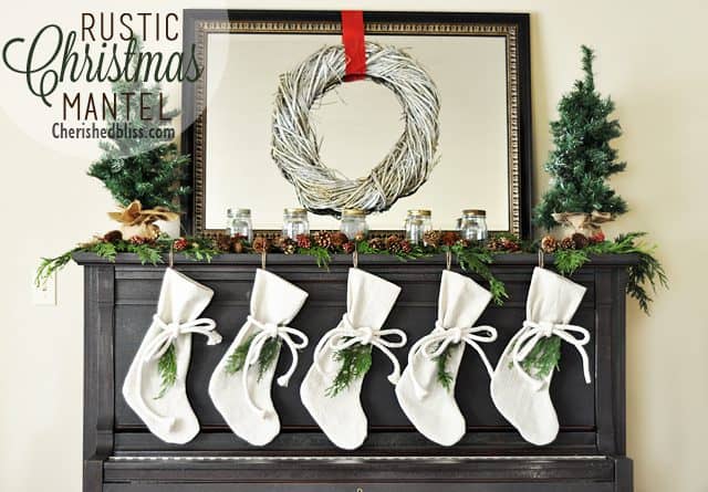 A Rustic Christmas Mantel featuring real cedar garland and drop cloth stockings A Rustic Christmas Mantel featuring real cedar garland and drop cloth stockings