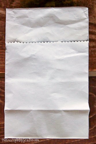white paper bag with the top folded over
