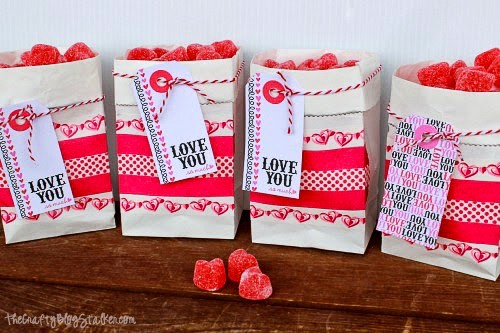 four treat bags lined up on a shelf