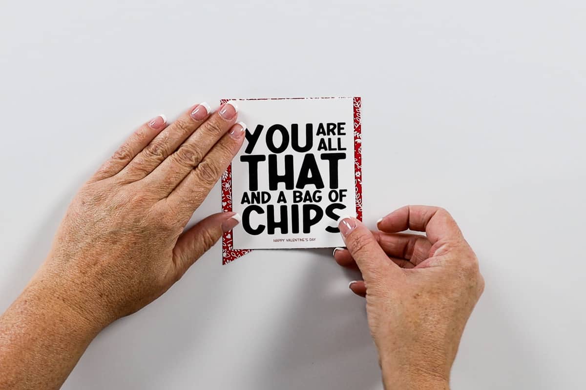 Placing a printable tag on top of a red patterned flag.