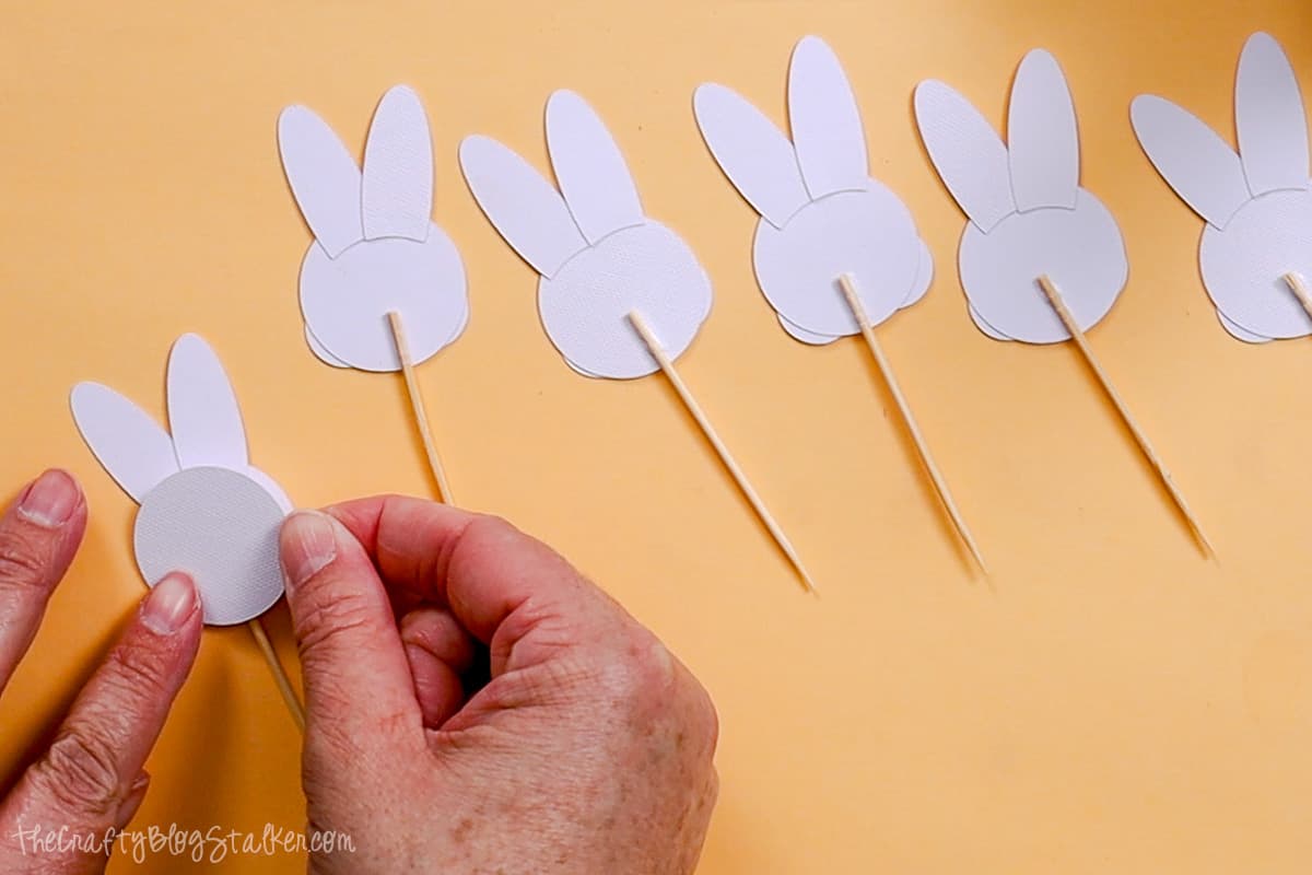 Placing a circle over the back of the bunny cupcake topper.