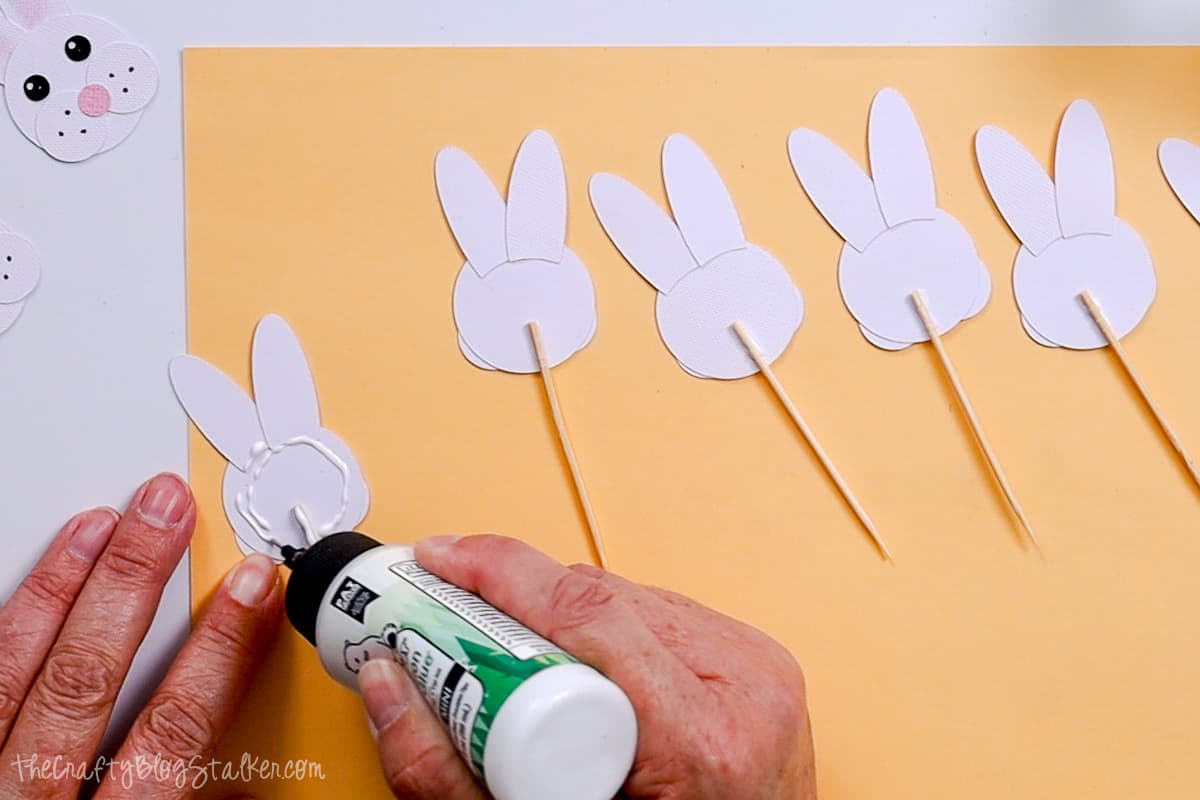 Adding more glue to the back of the bunny.