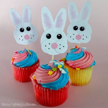 Three mini cupcakes with bunny cupcake toppers.