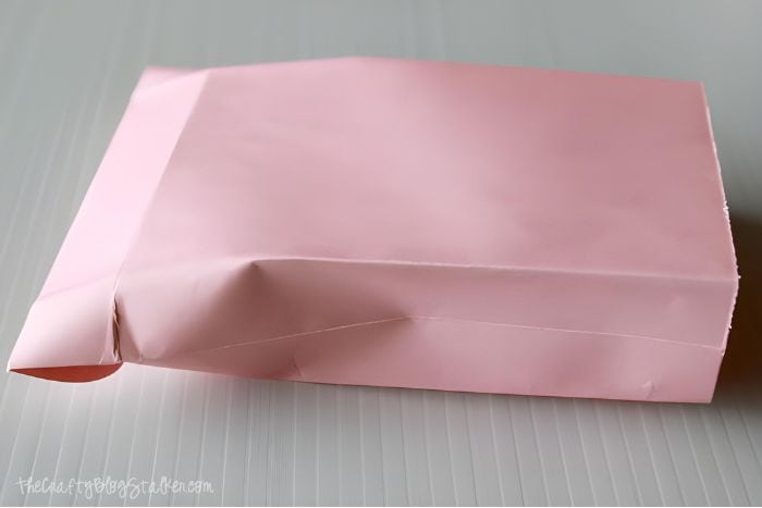 Open the envelope to give the bag its sides.