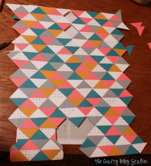 monogram letter covered with paper triangles