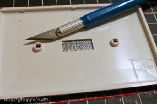 cutting out the hole with a craft knife