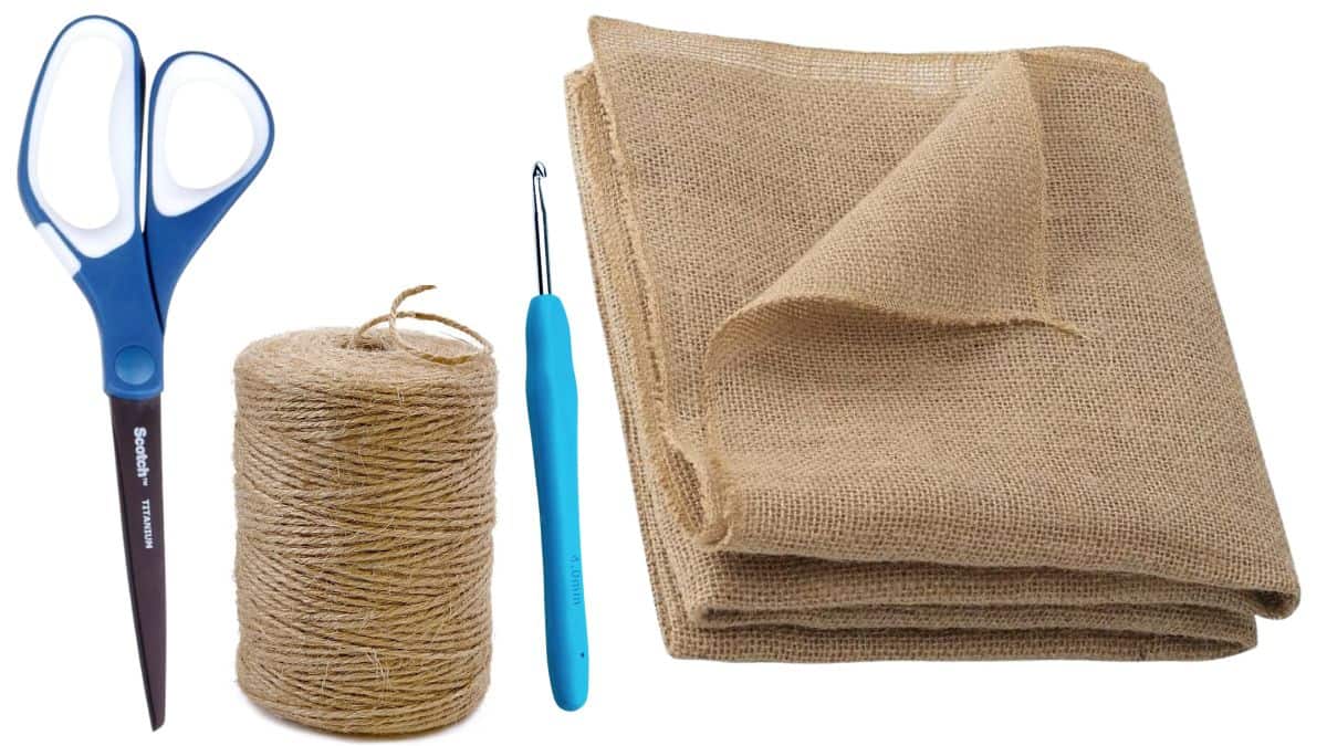 Craft supplies for a burlap flower holder including burlap fabric, twine, scissors, and a crochet hook on a white background.