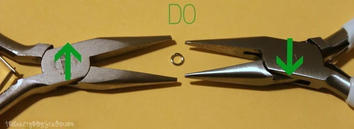Correct way to open a jump ring with jewelry pliers, twist in opposite directions.