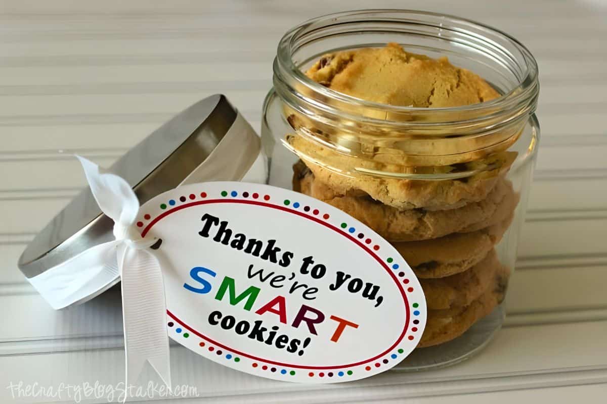 Cookies in a small glass jar with a printable tag to make a teacher gift.