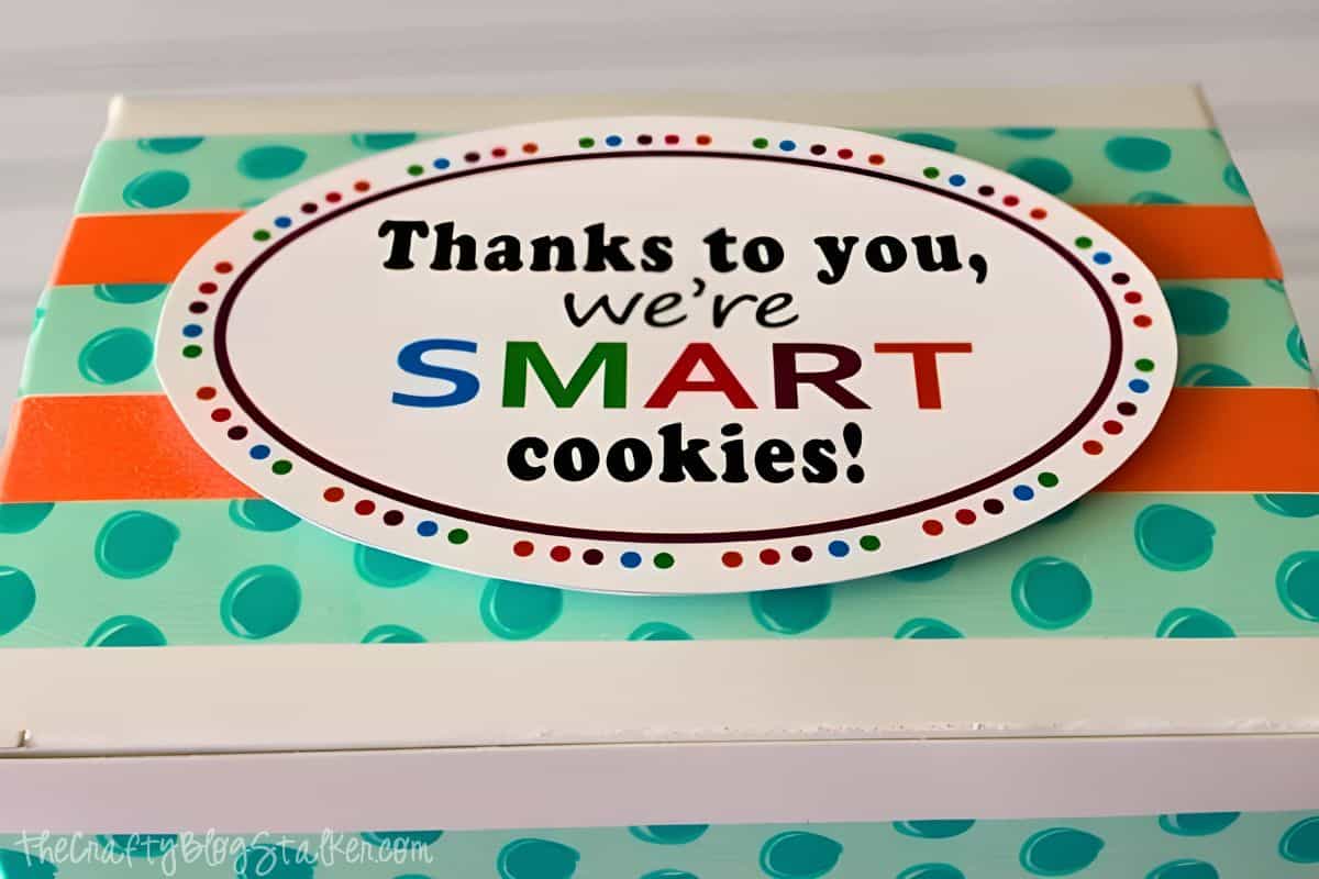 A box of cookies wrapped with washi tape and a smart cookie printable tag.