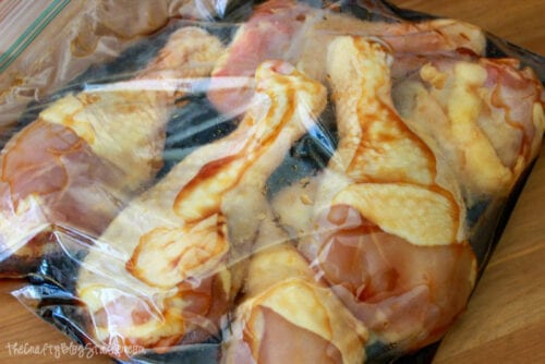 chicken drumsticks marinating in a ziploc bag