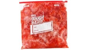 Frozen watermelon and agave mixture stored in a labeled freezer bag, ready to be scraped into a refreshing homemade snowball dessert.
