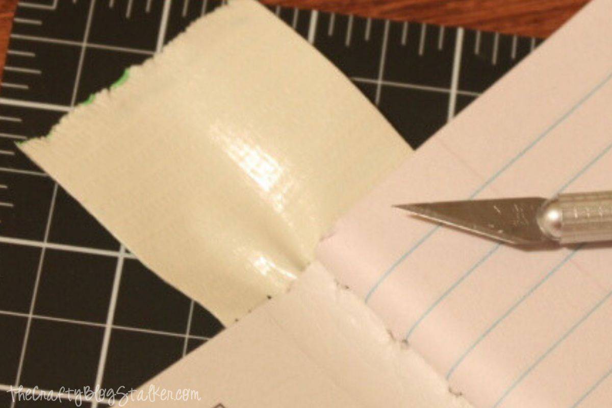 Excess duct tape to be cut off with a craft knife.