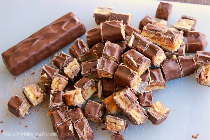 cutting Snickers candy bars into bite-sized pieces
