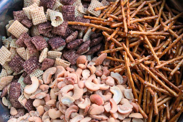 snack mix ingredients in a bowl before combining