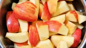 Chopped red and yellow apples ready for making applesauce.