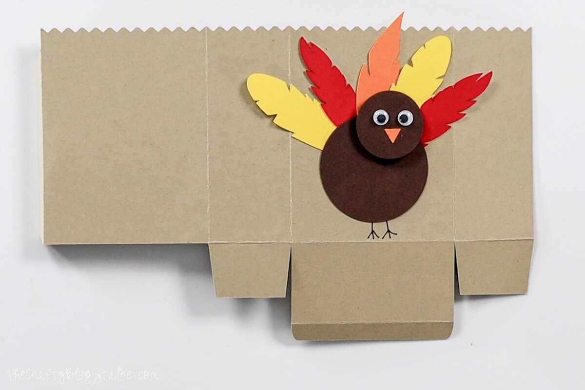 paper turkey glued to the front of the bag