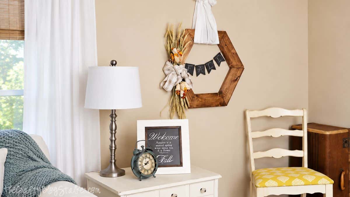 Hexagon Wooden Fall Wreath Tutorial | The perfect rustic accent to this years fall decor! Decorative hexagon wooden fall wreath with dried flowers and black banner.