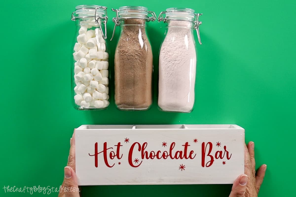 3 filled jars and a hot cocoa box.