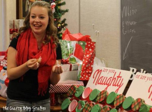 A girl laughing while playing the naughty or nice christmas game