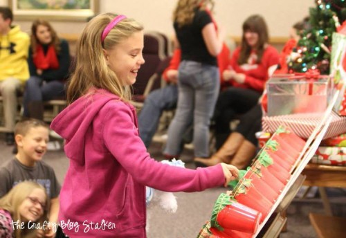 A girl playing the naughty or nice christmas game.