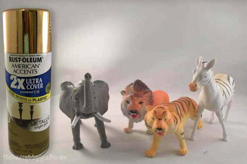 Toy animals and metallic gold spray paint.
