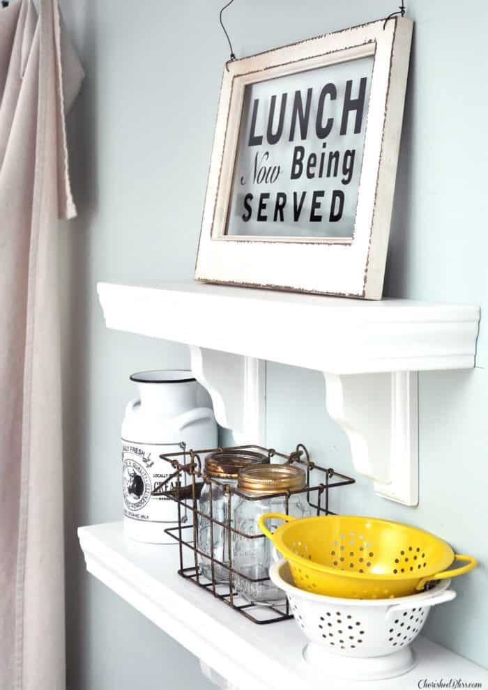 Build these easy Wooden Kitchen Shelves with just a few pieces of wood and trim. Get a quality product that costs less than store bought! 