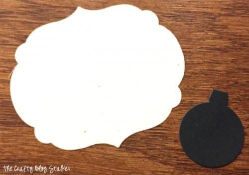two paper shapes used to make the soda gift tag