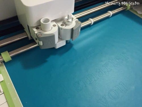 Cricut explore cutting out blue vinyl for a mirror decal