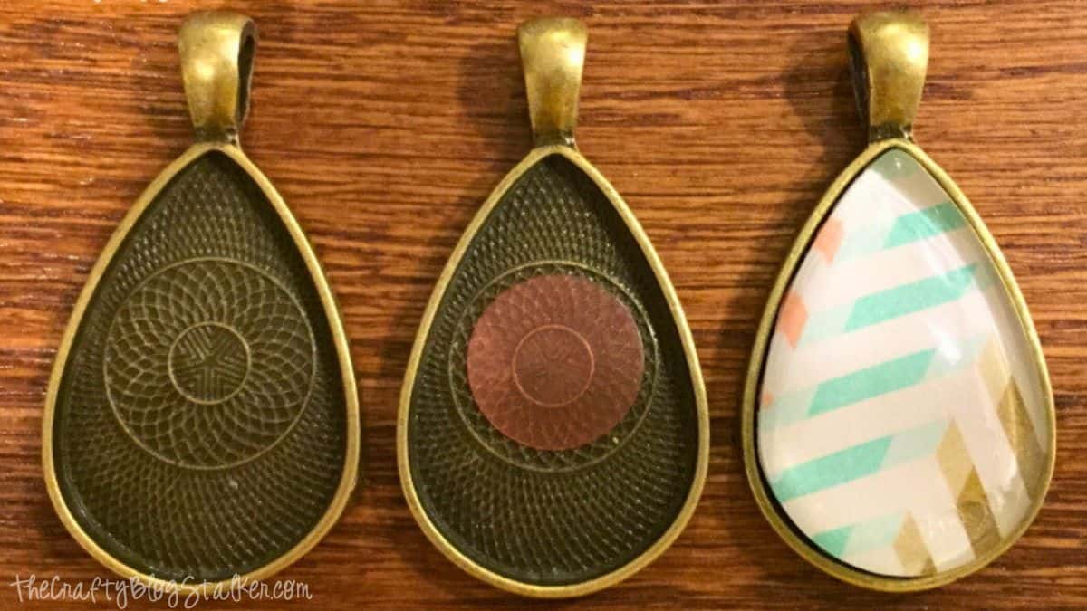 Three teardrop pendant trays shown in stages: empty tray, tray with adhesive insert, and finished pendant with patterned cabochon adhered on top.