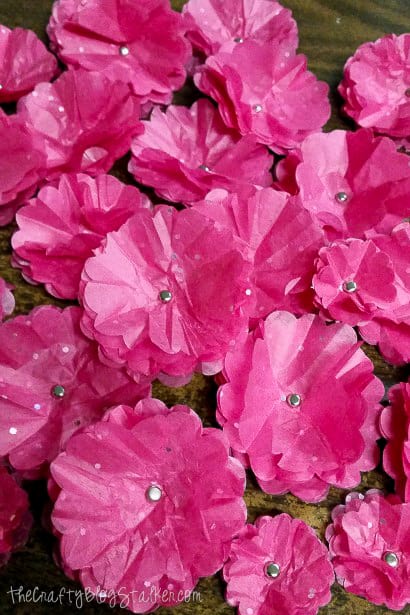 a pile of finished pink tissue paper flowers