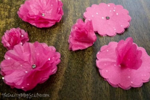 scrunching up layers of tissue paper to make flowers