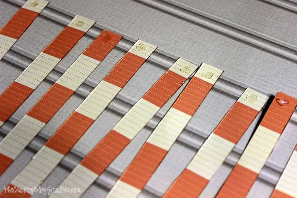 glue dots on the ends of strips of paper