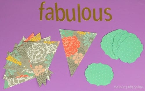 cut out paper pieces to make a fabulous paper pennant banner