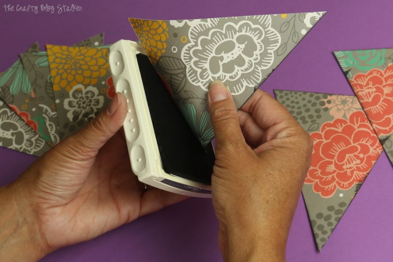 How to cut 8 triangle pennant shapes out of 1 sheet of paper.  Pennants make great banners for party and home decor. A simple DIY craft tutorial idea.