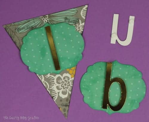 layering the paper pieces to make a fabulous paper pennant banner