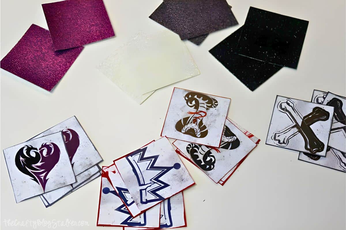 Inked icon squares and glitter paper squares.