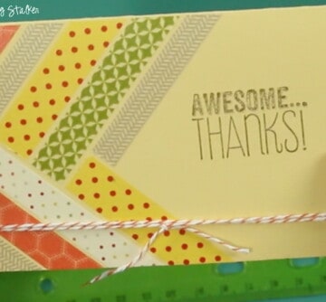 A handmade card will brighten anyone's day. A simple DIY craft tutorial idea, all you need is some washi tape, baker's twine, and a stamped greeting.
