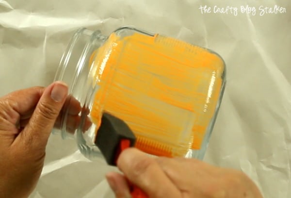 painting the glass jar with orange gallery Glass Paint and a sponge brush