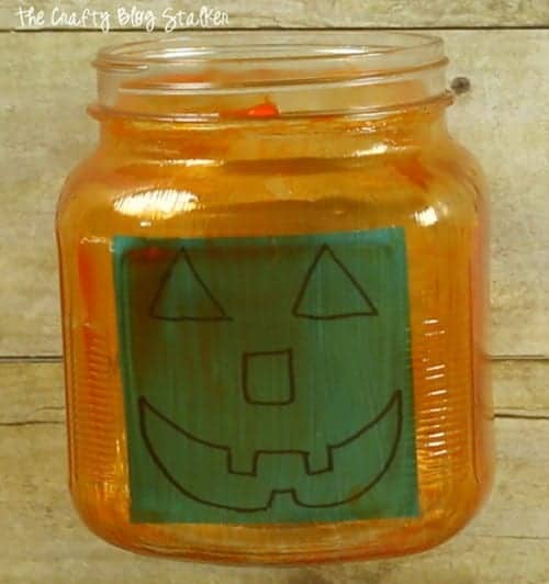 sticky note inside the jar to trace for the jack o lantern face