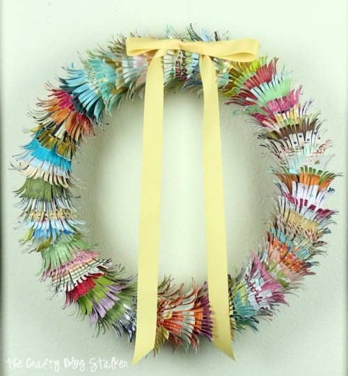 Fringe paper wreath with a yellow ribbon bow.
