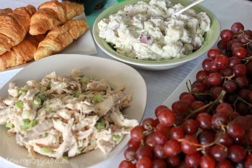 chicken salad with grapes, croissants and a side