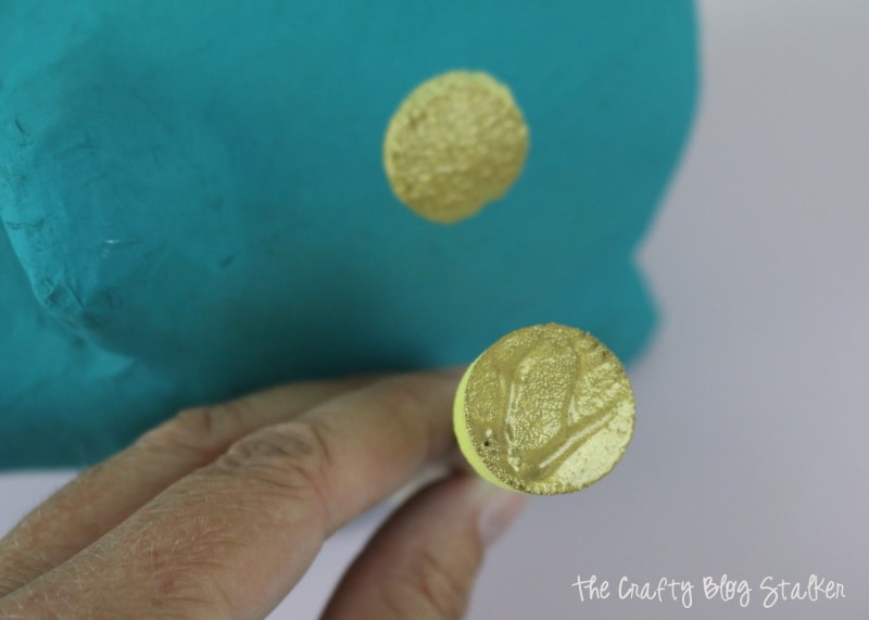 applying polka dots with gold acrylic paint and a sponge dauber
