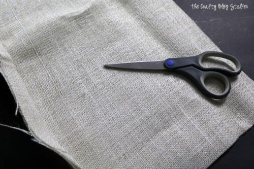 burlap fabric and a pair of scissors