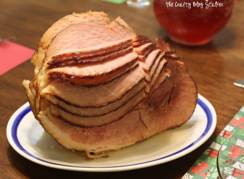 A spiral-cut ham  on a plate, on a table.