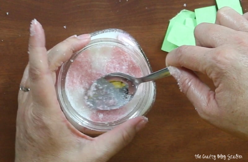flattening the sugar scrub in the jar