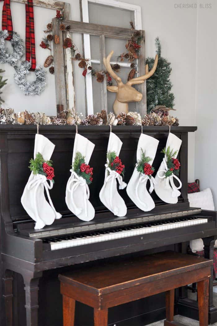 Super Cozy Christmas Mantel with drop cloth stockings, mini wreaths, pine cones, and a deer head!  Super Cozy Christmas Mantel with drop cloth stockings, mini wreaths, pine cones, and a deer head!